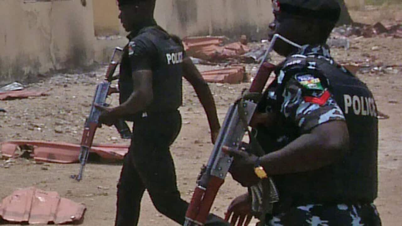 security walk past a burnt out building