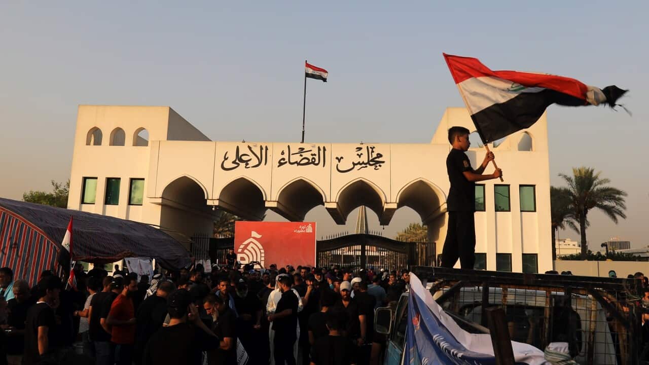 upporters of Iraqi Shiite cleric Muqtada al-Sadr, head of the Sadrist movement, gather in front of the Supreme Judicial Council, Baghdad, Iraq, 23 August 2022.