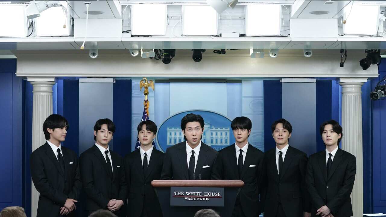 Members of the K-pop supergroup BTS join White House press secretary Karine Jean-Pierre during the daily briefing at the White House, Tuesday, May 31, 2022, in Washington. (AP Photo/Evan Vucci)