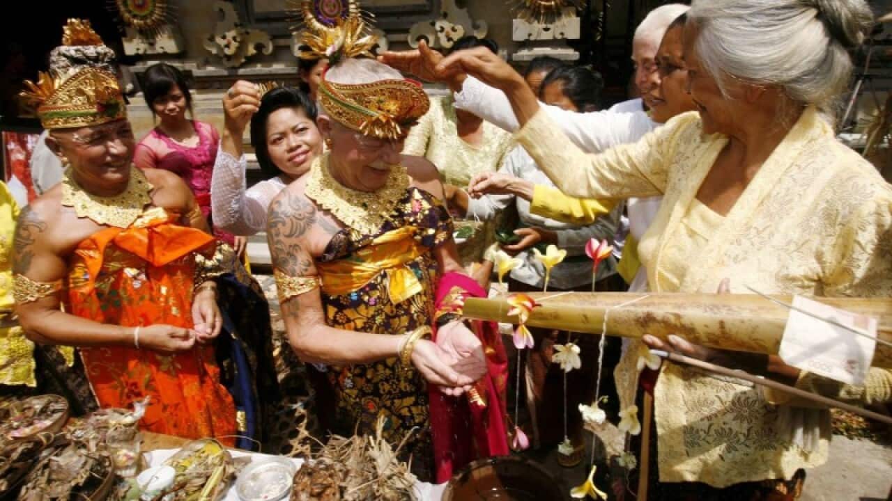 Gay men doing symbolic Balinese marreid ceremonial which has outraged Indonesian as well as the Balinese.