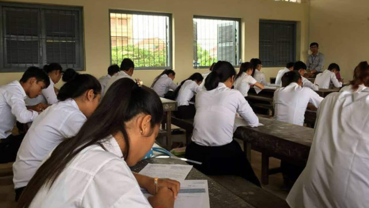 students sit in an exam