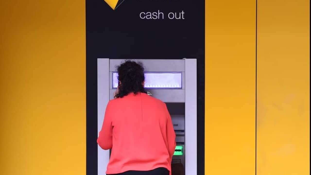 A customer uses a Commonwealth Bank ATM