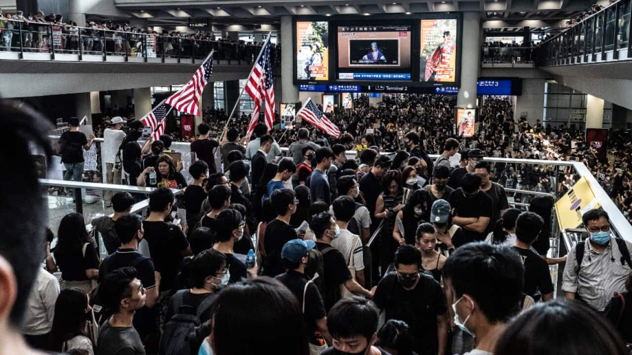 Thousands of protesters descend on the Hong Kong International Airport in Hong Kong on August 12, 2019 to protest the police treatment of protesters