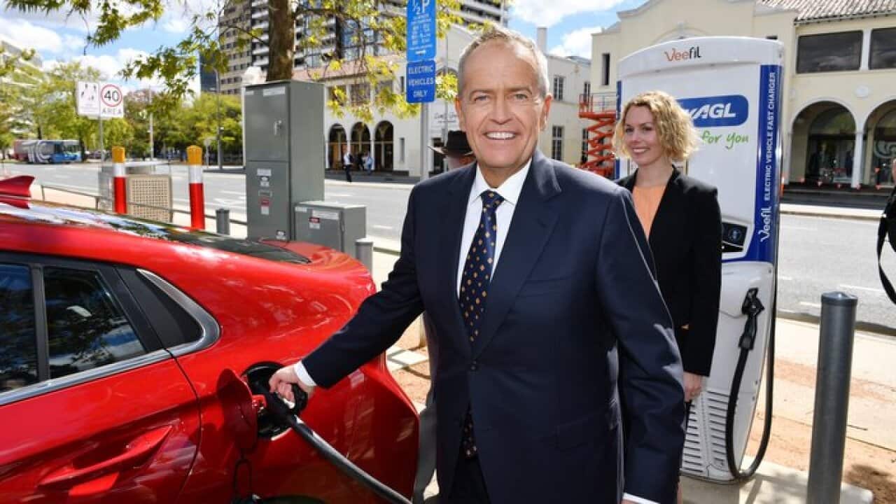 Leader of the Opposition Bill Shorten charges an electric car after launching Labor's Climate Change Action Plan at the Actewagl Electric Car Charging Station in Canberra, Monday, April 1, 2019. (AAP Image/Mick Tsikas) NO ARCHIVING