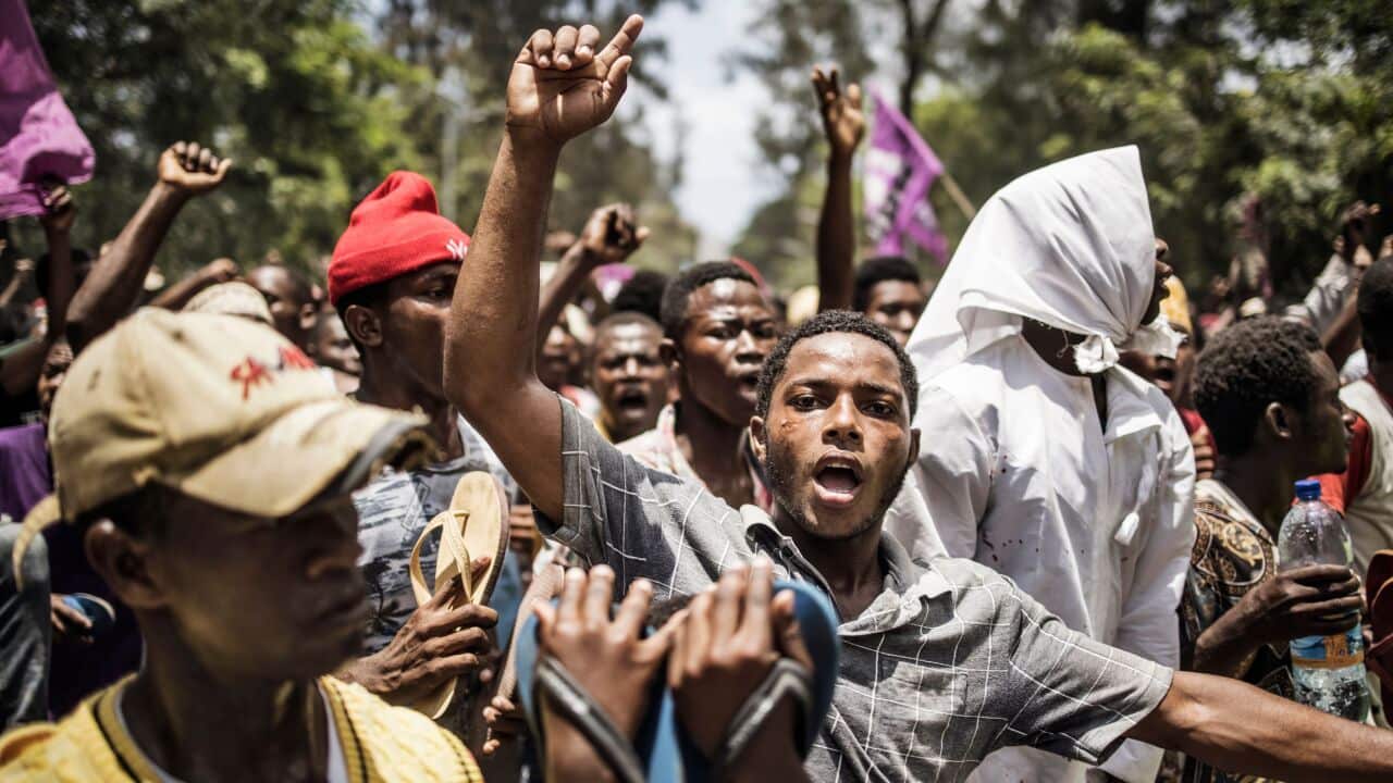 Supporters of Tanzanian opposition party The Alliance for Change and Transparency take part in the party's last political rally, in Stone Town on 25 October.