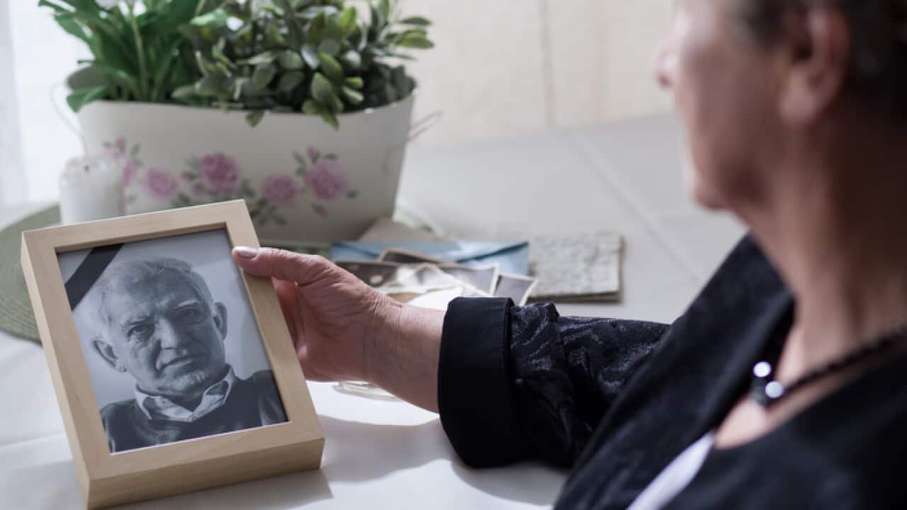 Widow looking at the photo