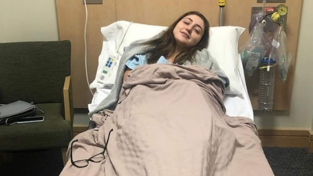 Woman in hospital bed