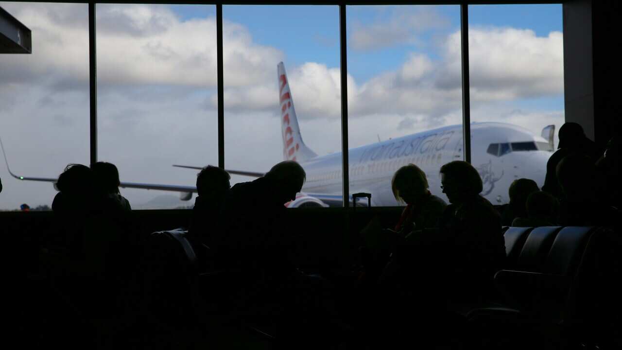 Health authorities are scrambling to contact passengers on five flights after a Sydney-based Virgin cabin crew member tested positive to COVID-19.