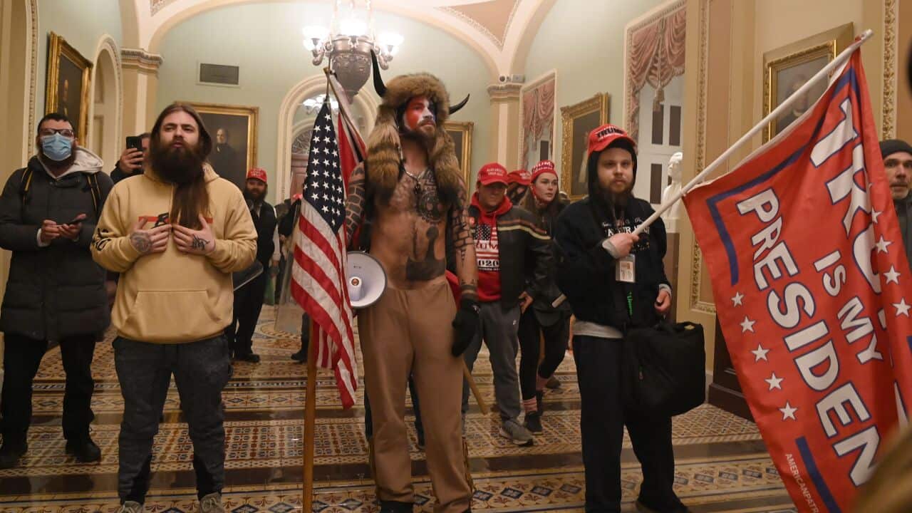Jake Angeli and fellow Trump supporters stormed the US Capitol.
