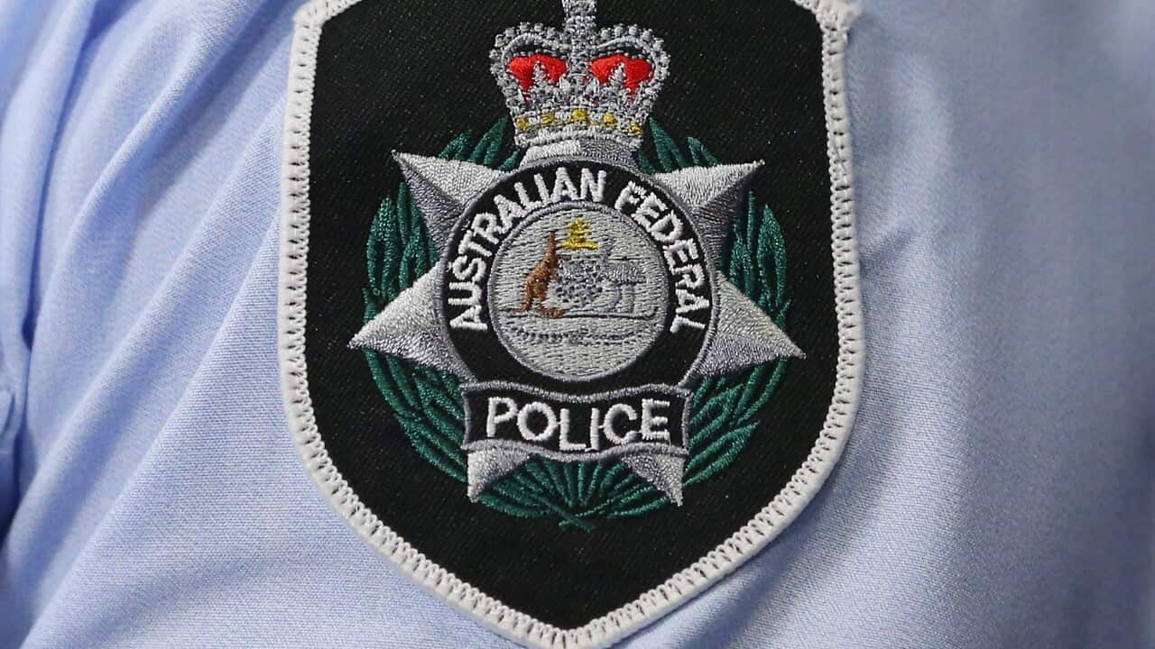 The Australian Federal Police badge on a shirt.