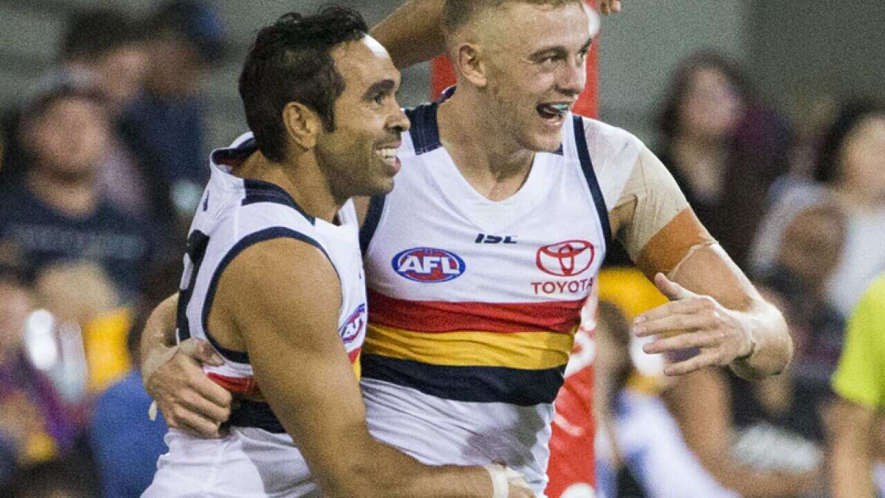 Hugh Greenwood (R) of the Crows celebrates with teammate Eddie Betts