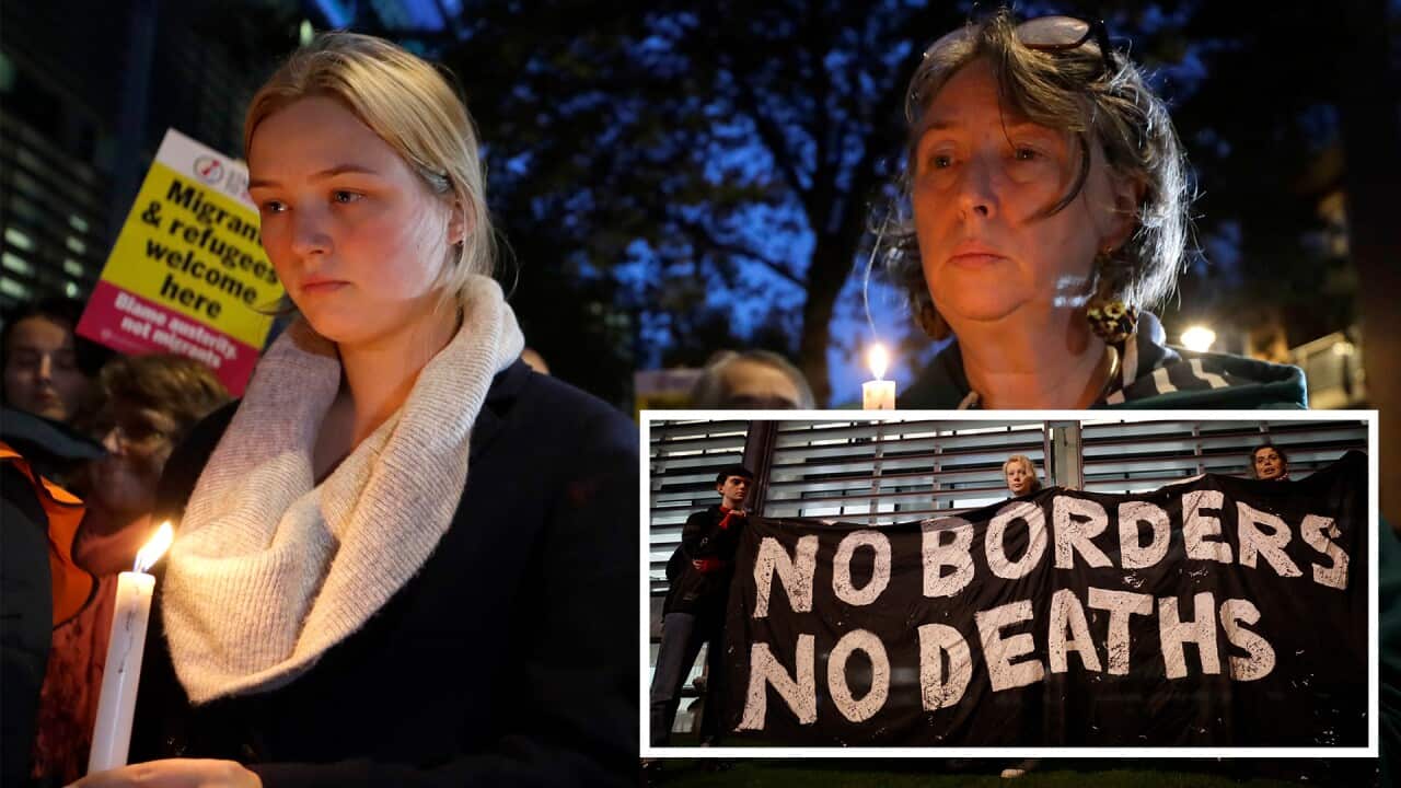 Signs and candles on a wall were placed at a vigil for the 39 lorry victims, outside the Home Office in London.
