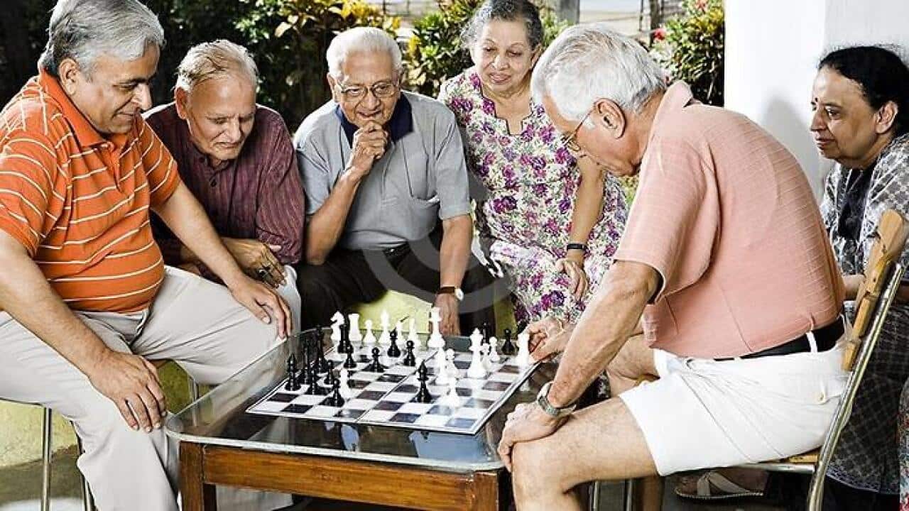 Older residents enjoying a game of chess
