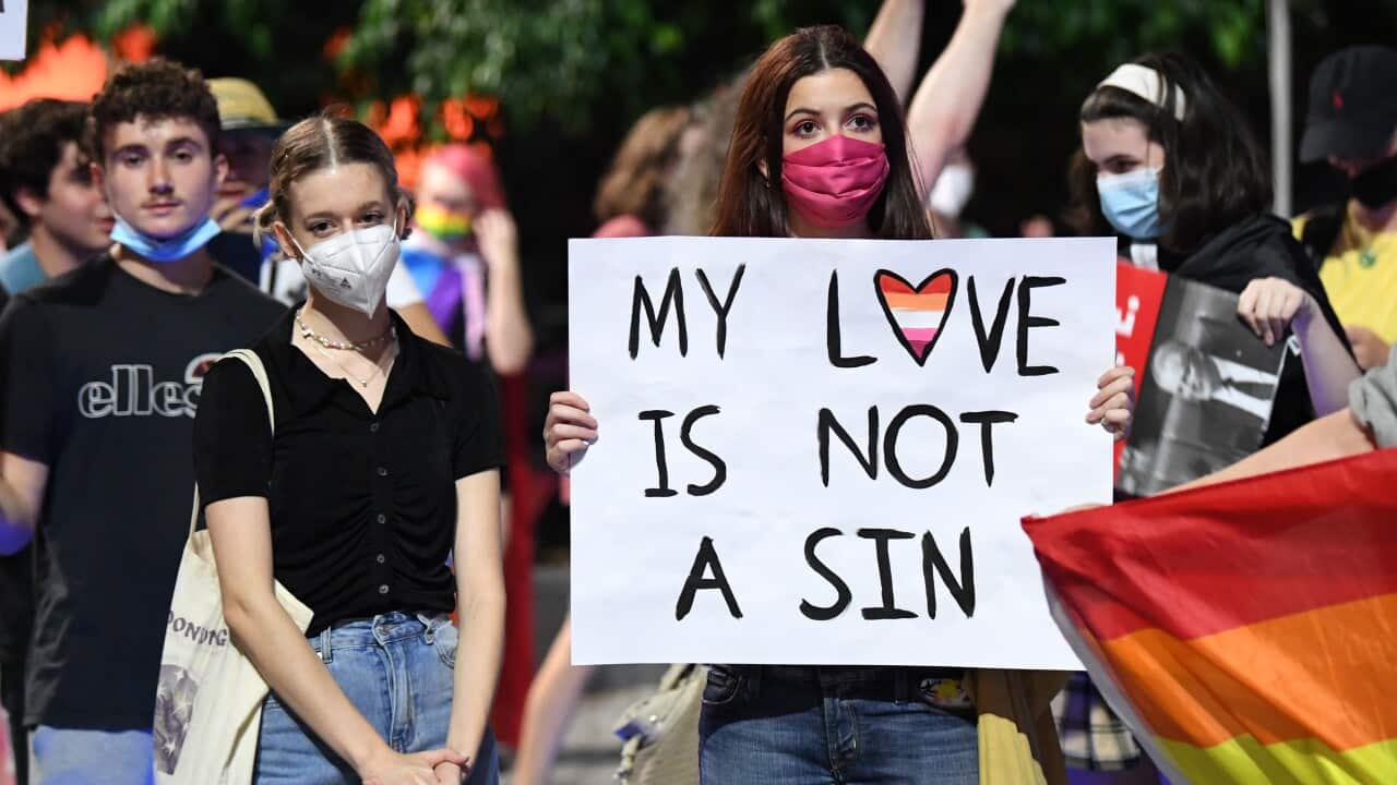 Supporters and members of the LGBTIQ+ community protesting against Citipointe Christian College during a rally in Brisbane.