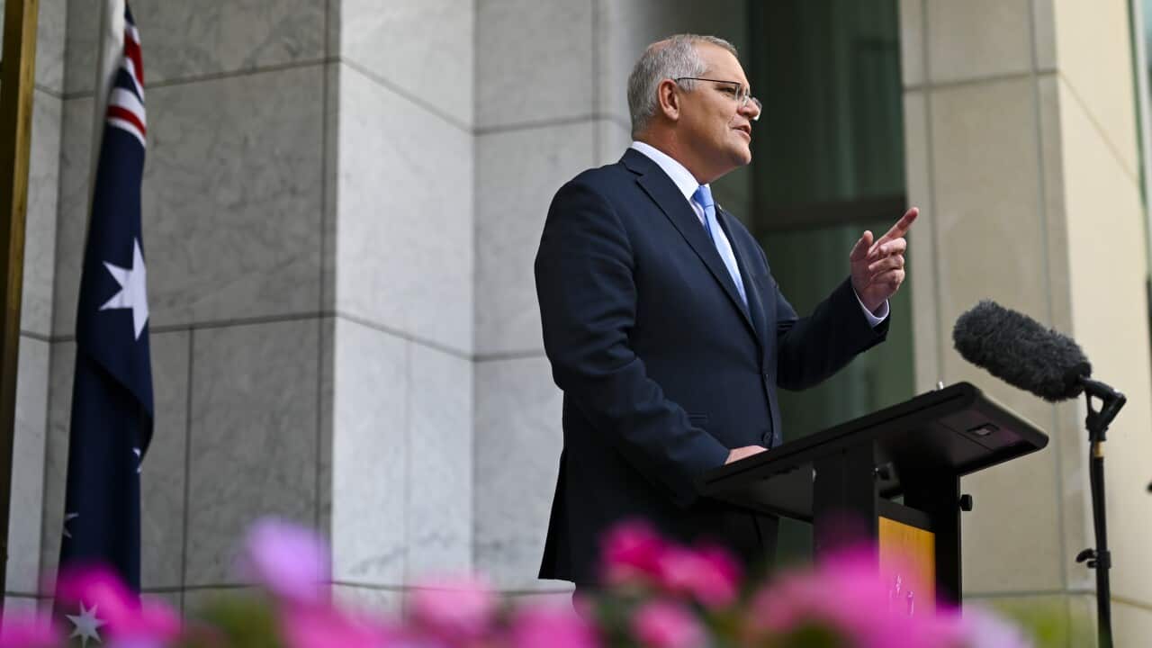 Australian Prime Minister Scott Morrison arrives to speak to the media announcing a 21 May election during a press conference at Parliament House in Canberra, Sunday, April 10, 2022. (AAP Image/Lukas Coch) NO ARCHIVING