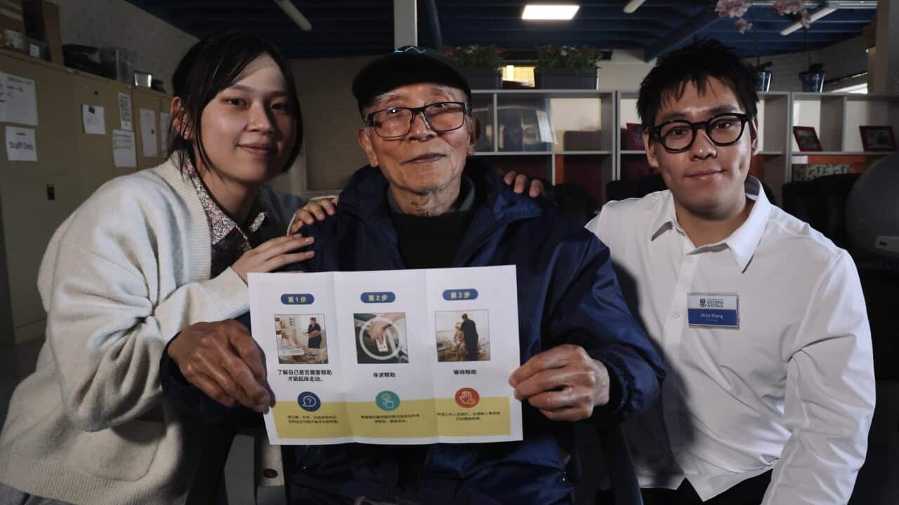 University students Zhou Yuening and Zhang Shijie with elder Liu Xuxiang at a falls prevention workshop in Perth (Christopher Tan SBS).jpg