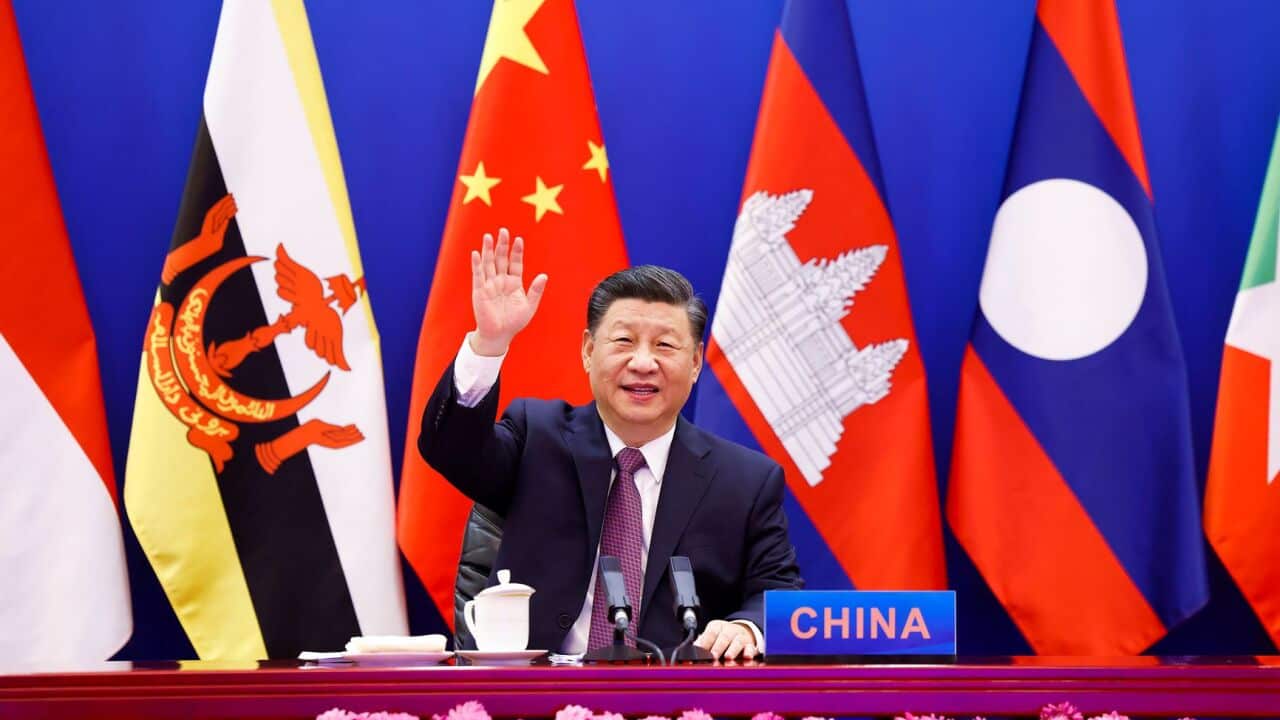 In this photo released by Xinhua News Agency, Chinese President Xi Jinping waves as he chairs the ASEAN-China Special Summit to commemorate the 30th Anniversary of ASEAN-China Dialogue Relations via video link from Beijing, China on Monday, Nov. 22, 2021.