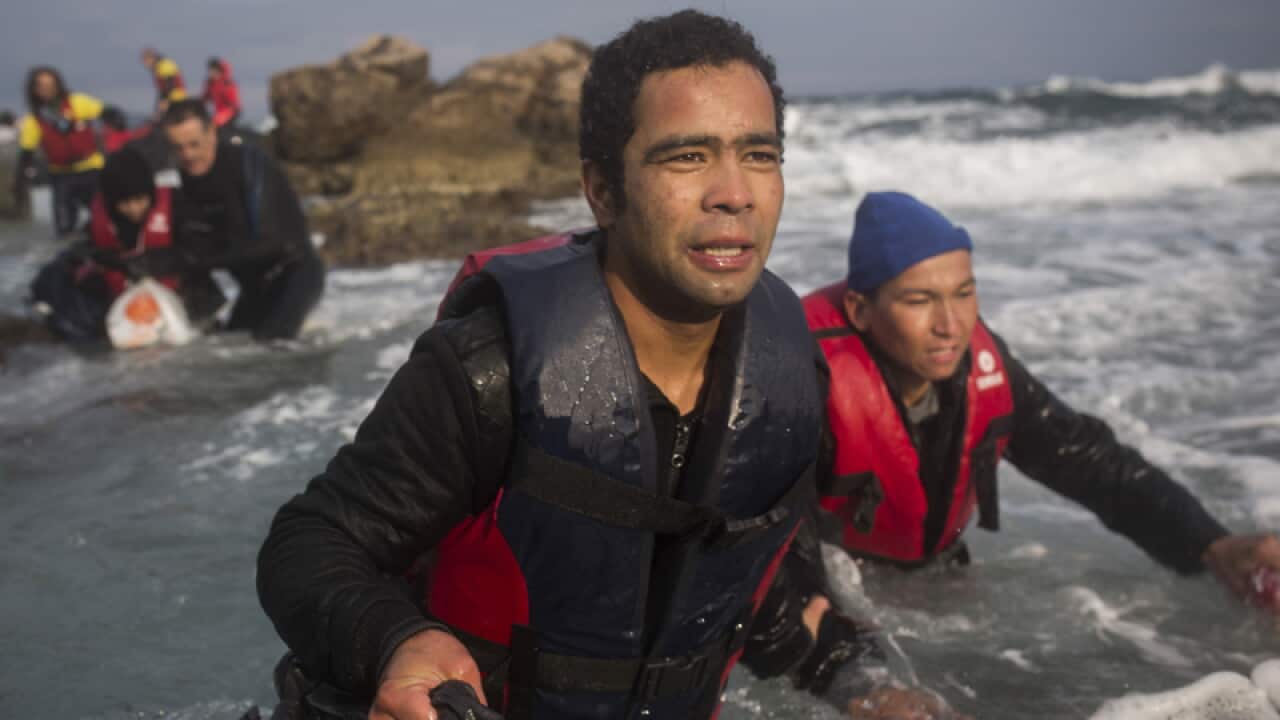 Refugees and migrants make their way out of the Aegean sea