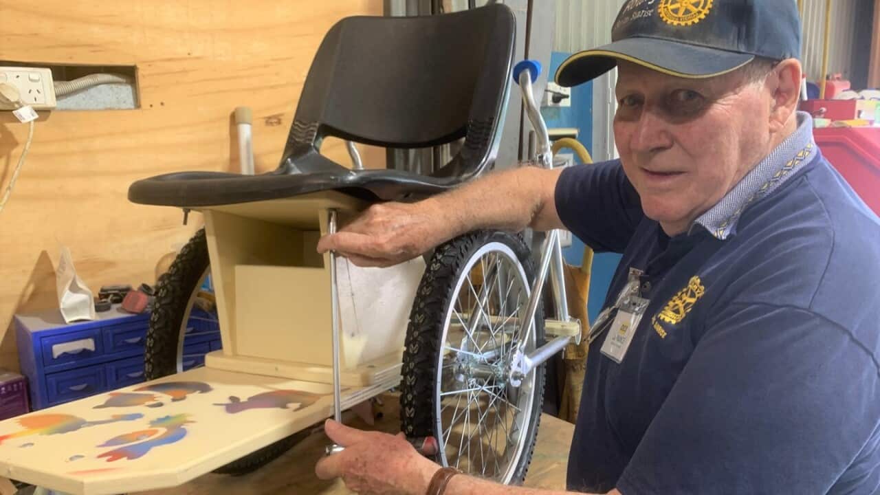 Inventor Des La Rance with a wheelchair made from repurposed bicycles. SBS, Matt Guest .jpg