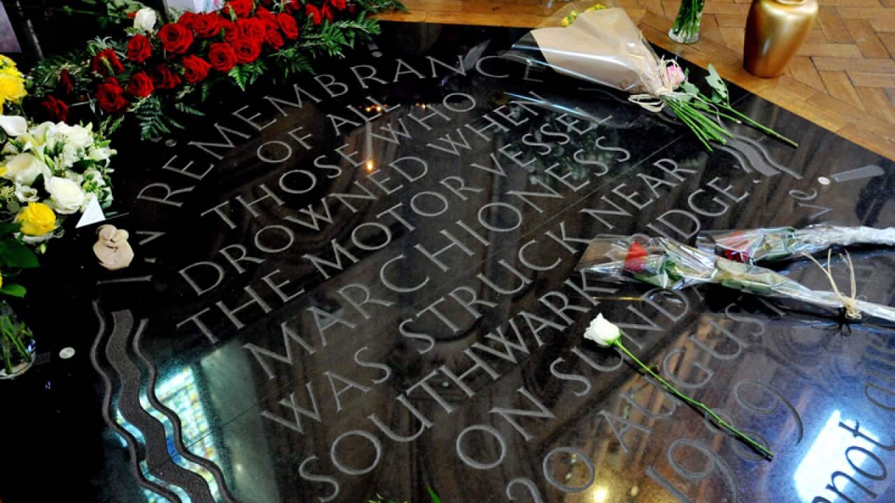 Flowers left on the memorial to mark the Marchioness riverboat sinking