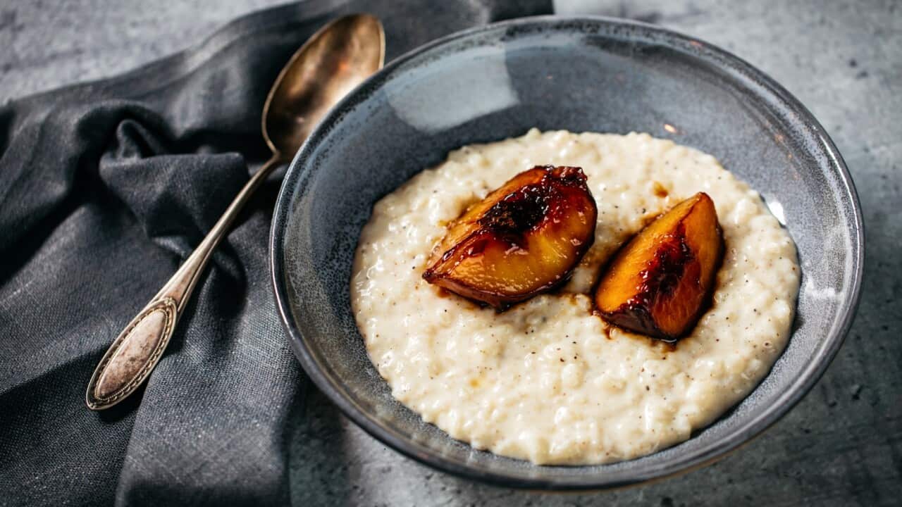 Creamed rice with caramelised peach and wattleseed