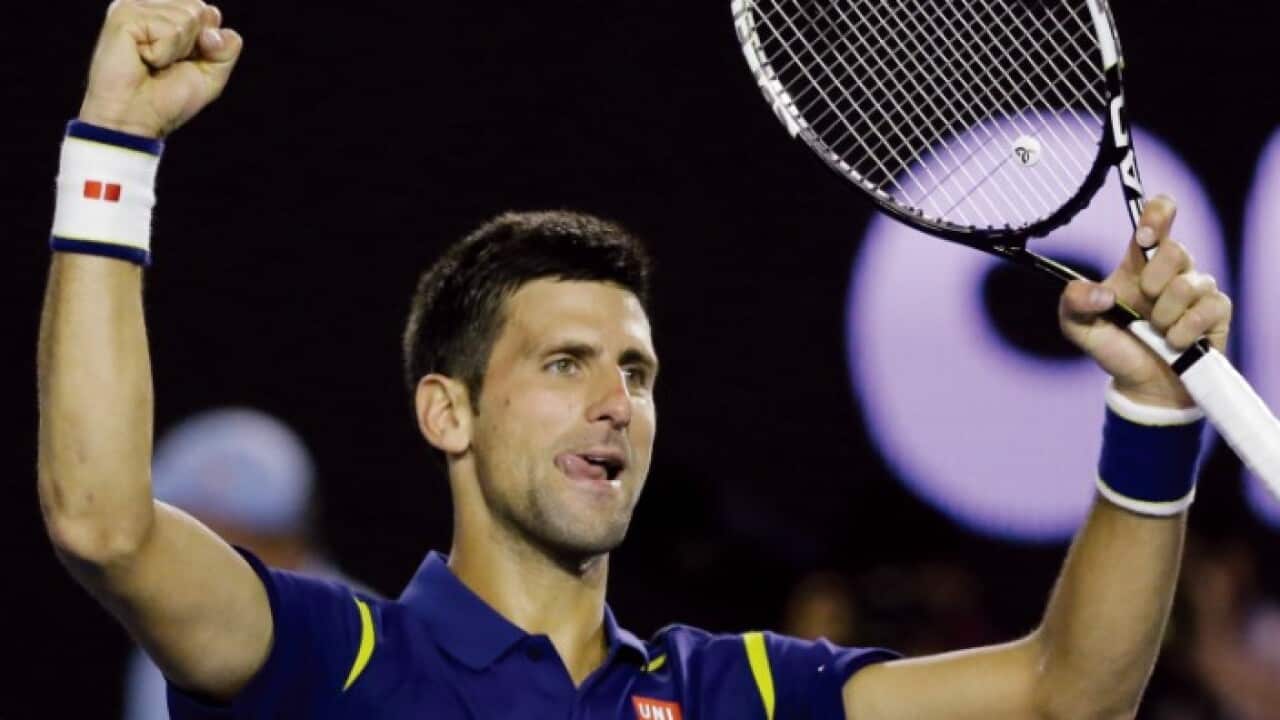 Novak Djokovic of Serbia celebrates after defeating Roger Federer of Switzerland in their semifinal match at the Australian Open tennis championships in Melbourne, Australia, Thursday, Jan. 28, 2016.(AP Photo/Aaron Favila)