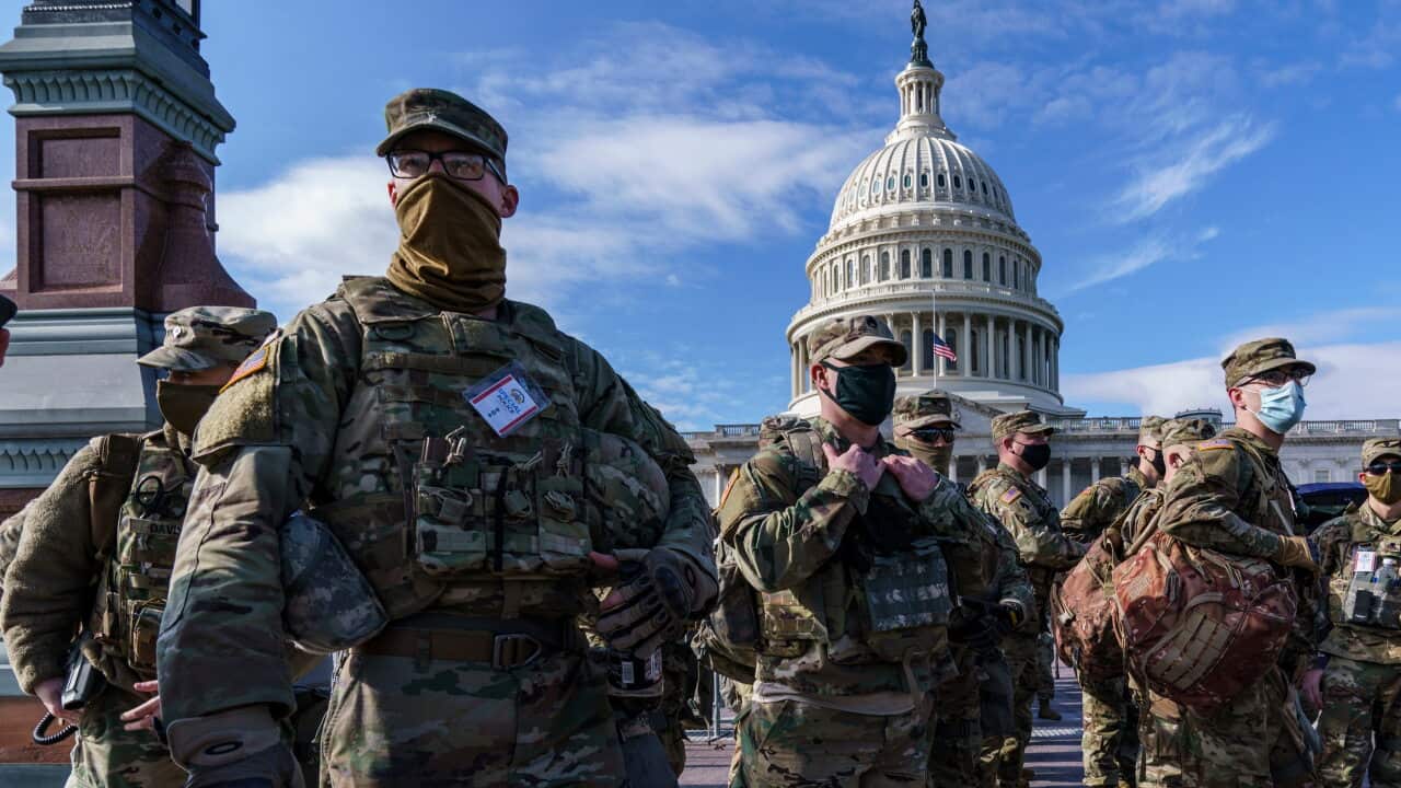 A dozen National Guard troops have been removed over right-wing militia ties.
