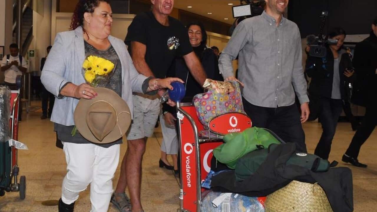 Australian filmmaker James Ricketson (C)