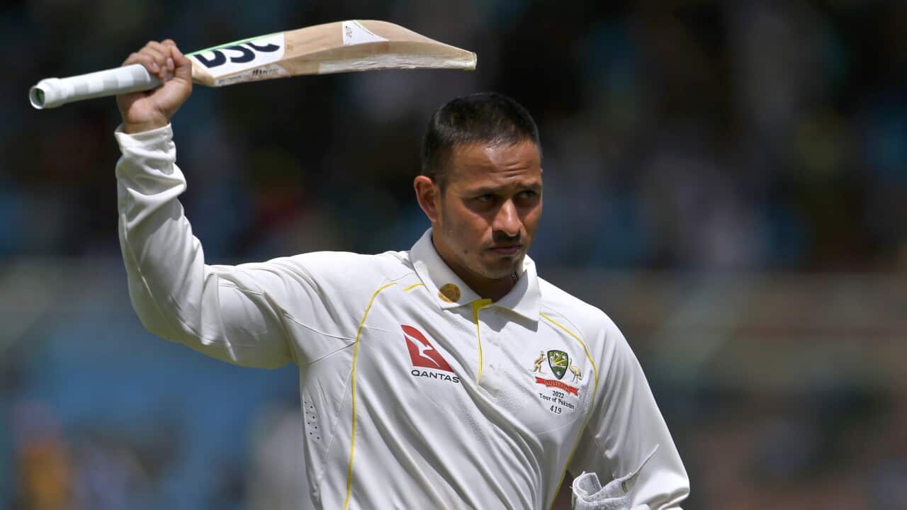 Australia's Usman Khawaja raises his bat