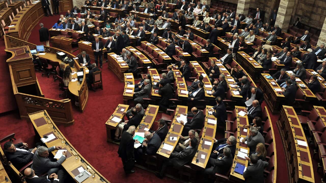 Greek parliament lawmakers take a vote
