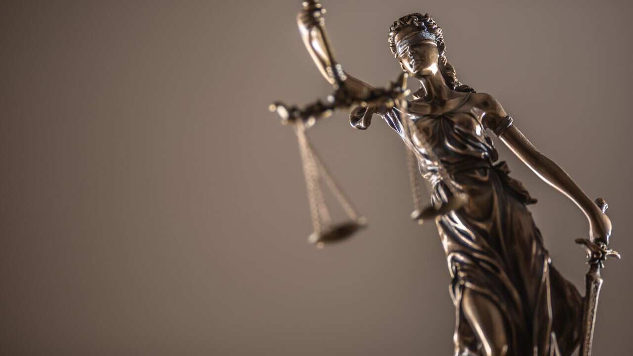 Statue of the lady of justice with scales close-up.