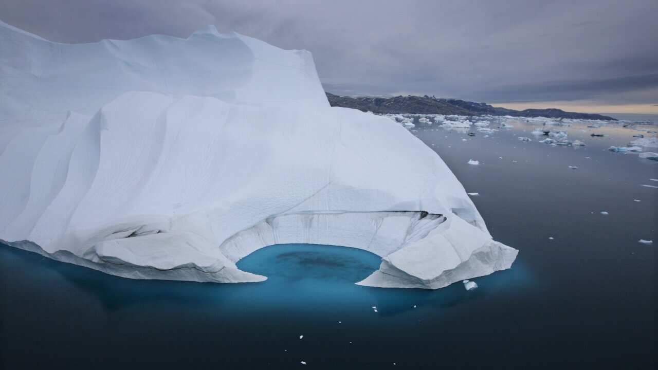 An iceberg is seen melting off the coast of Ammasalik, Greenland.