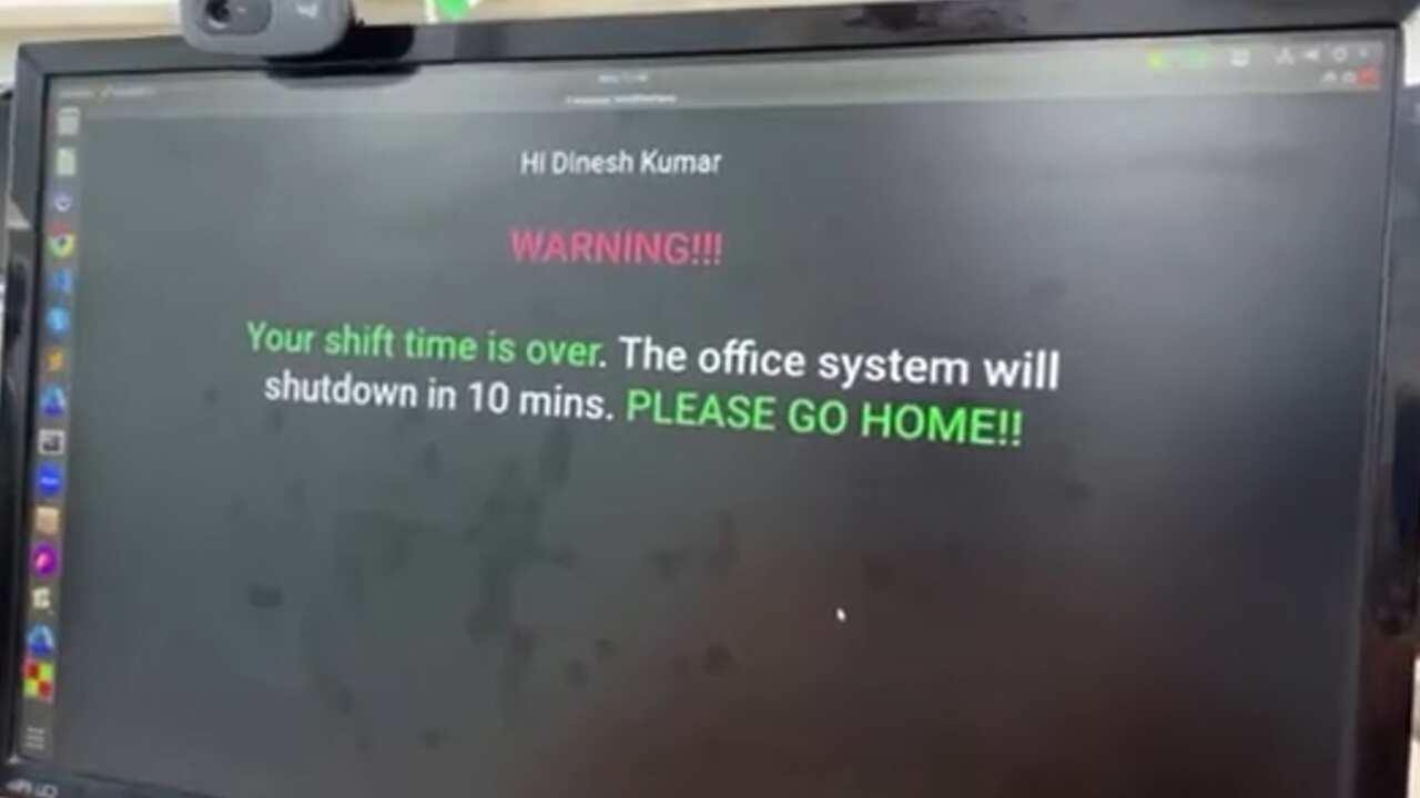A computer screen with a message that reads: WARNING!!! Your shift time is over. The office system will shutdown in 10 mins. PLEASE GO HOME!!".