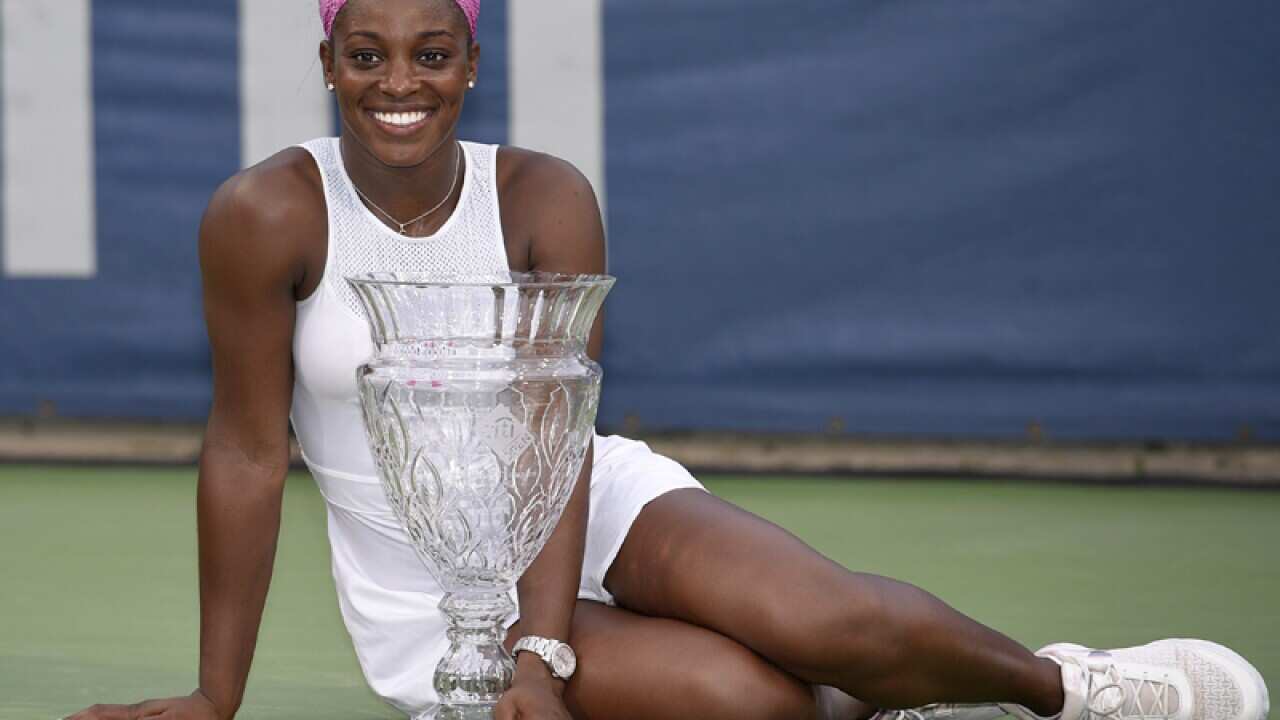 Sloane Stephens poses with the Citi Open trophy