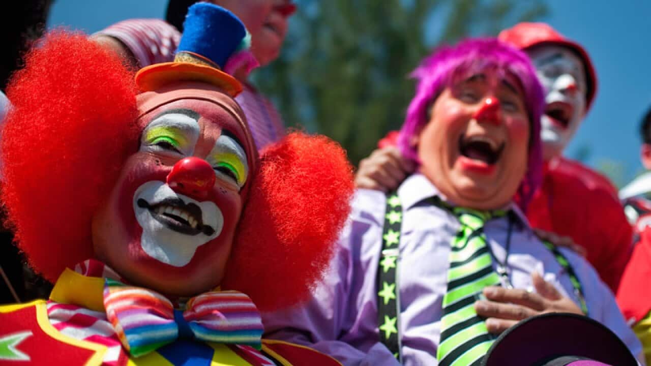Amid the continuing violence of Mexico’s drug war, 300 professional clowns demonstrated by laughing for 15 minutes non-stop in the name of world peace in Mexico City. (Getty)