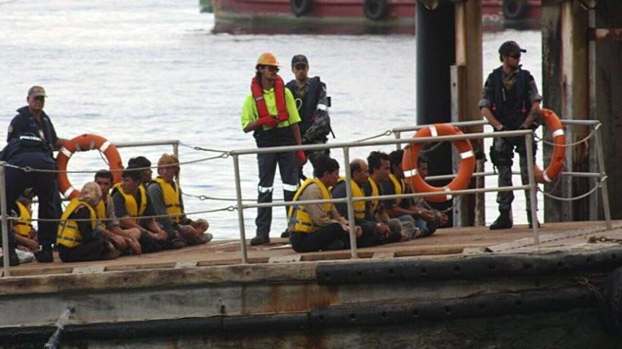 A boat carrying asylum seekers arrives at Christmas Island.