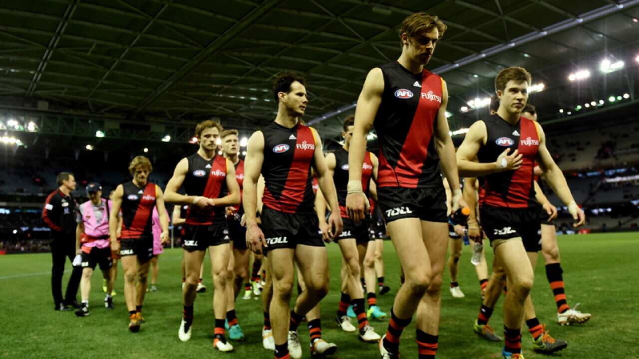 The Bombers walk off after losing the round 18 AFL match