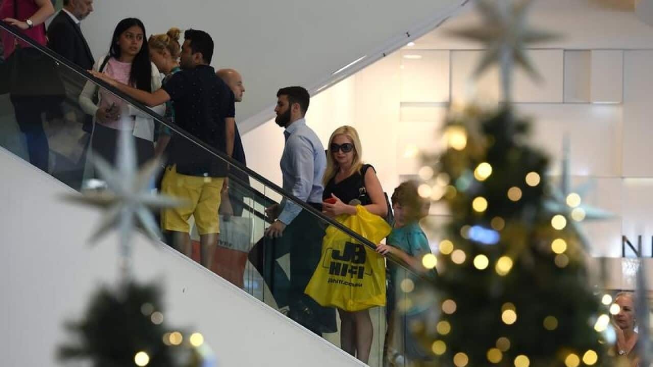 Shoppers are seen carrying out last minute Christmas shopping
