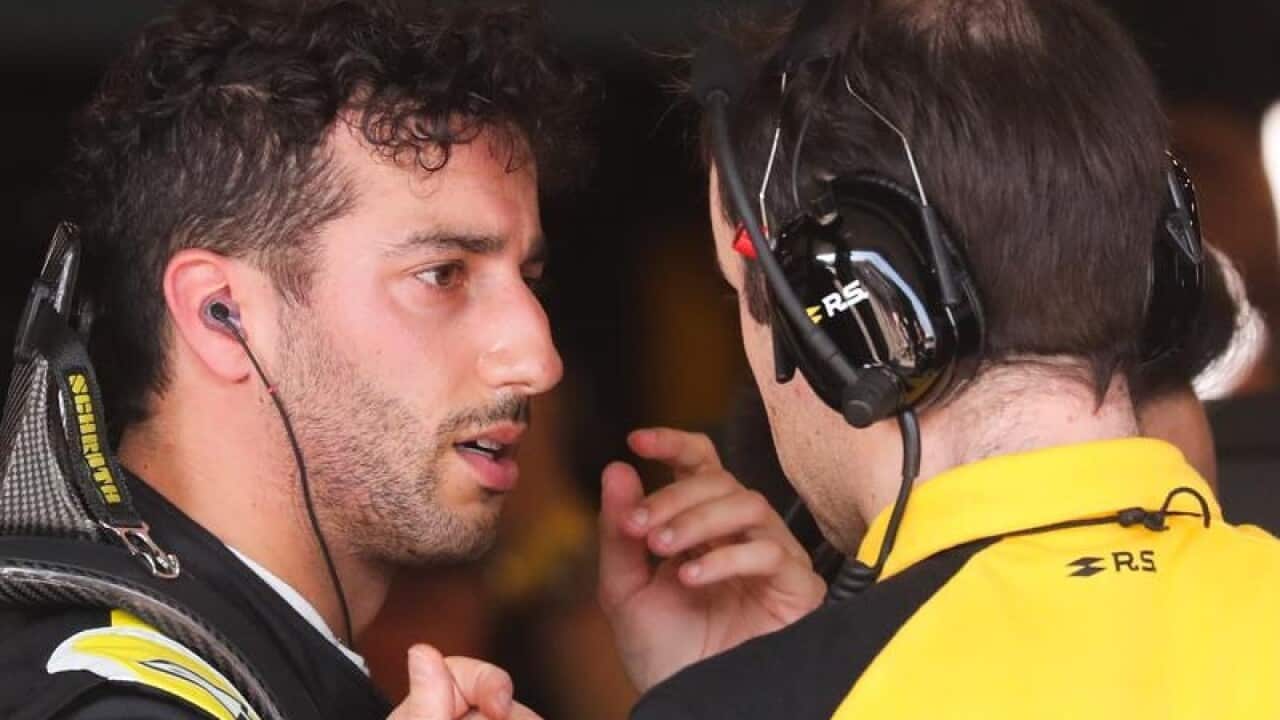 Daniel Ricciardo with a team member