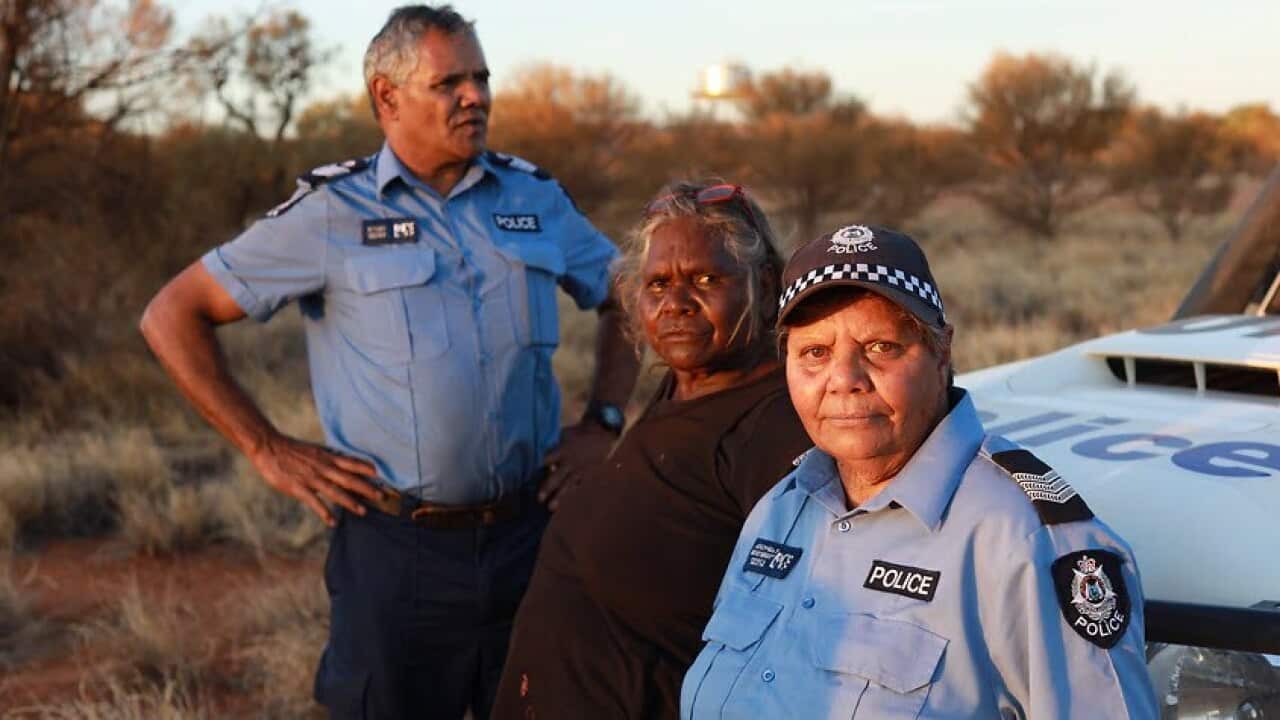Senior sergeant Revis Ryder and Senior Constable Wendy Kelly with Yarnangu Elder Daisy Ward.