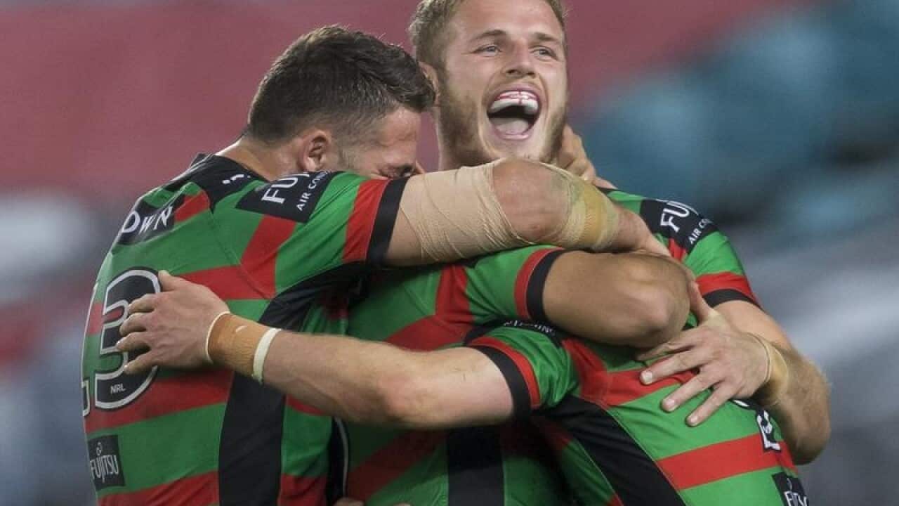Souths players celebrate after scoring a try