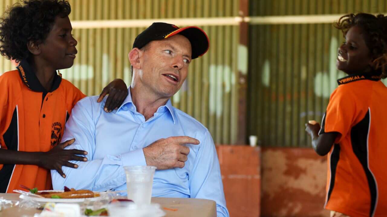 Tony Abbot with indigenous children in Arnhem land.