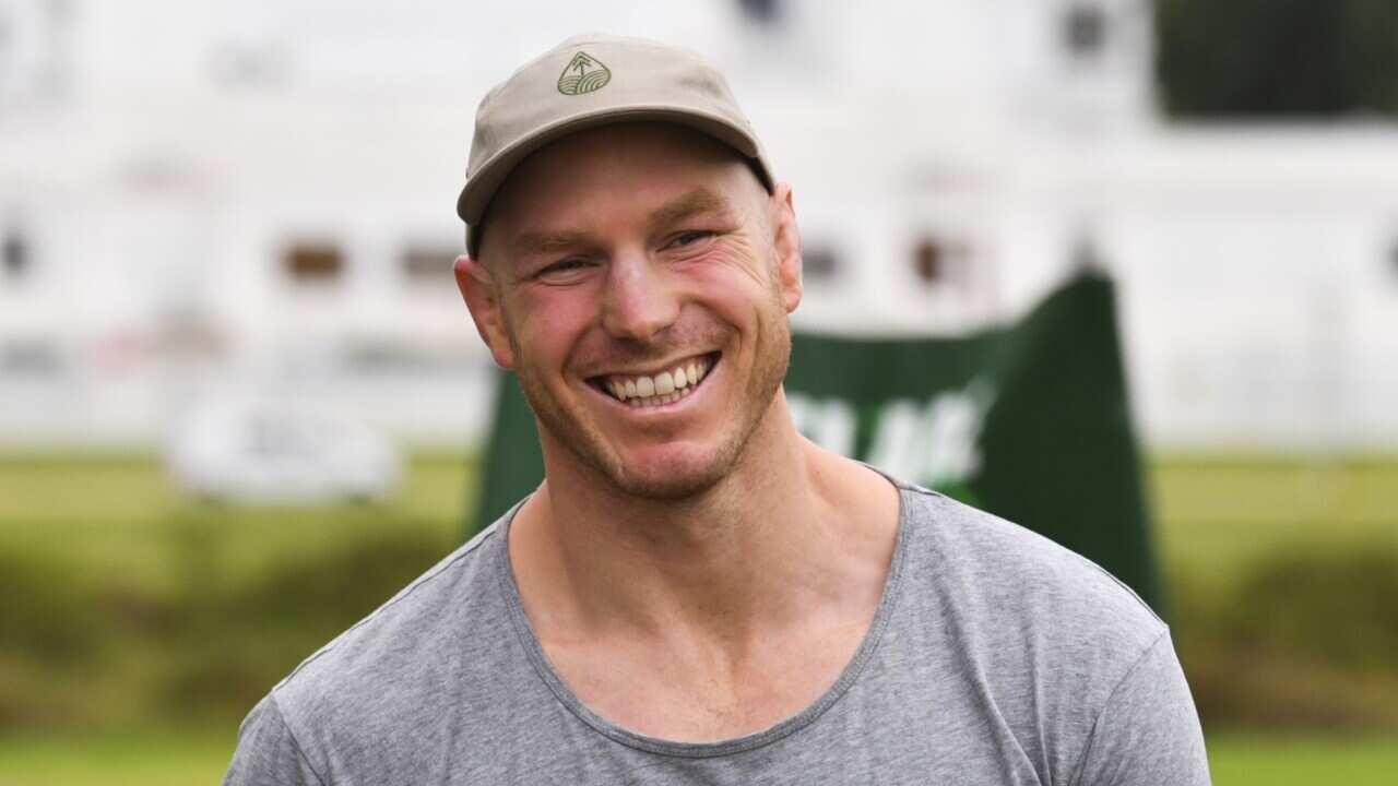 Former Wallaby player David Pocock attends a climate change rally outside Parliament House, in Canberra, Tuesday, February 2, 2021.
