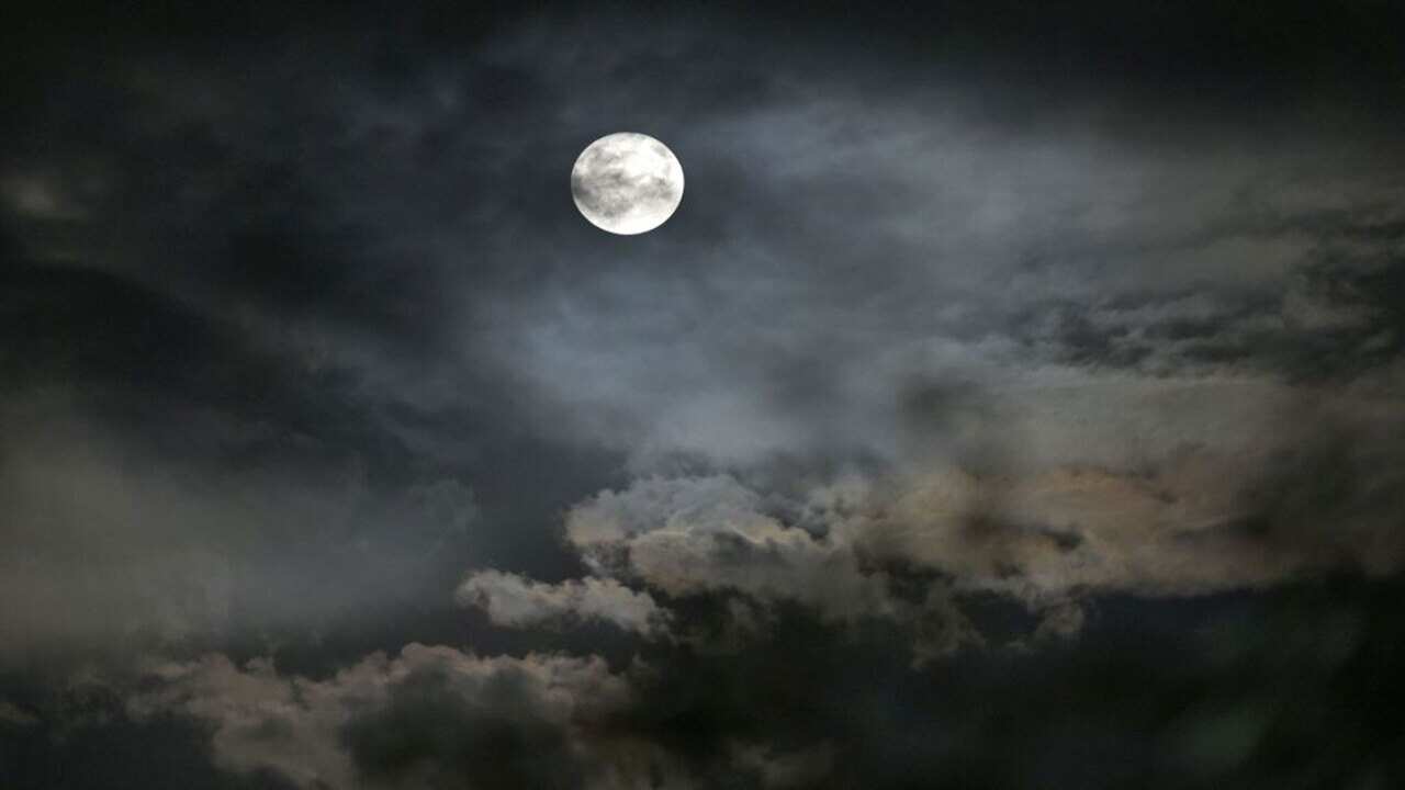 This picture shows the full moon seen from Srinagar on July 27, 2018.