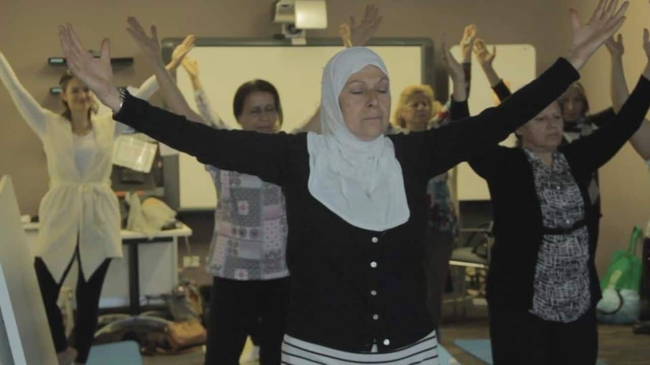 Vulnerable women practicing yoga as a therapeutic approach to heal from traumas