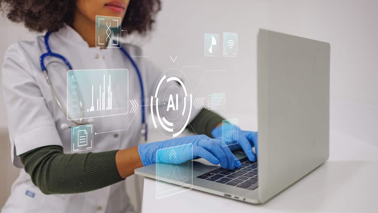 Doctor wearing blue gloves using a laptop with ai and healthcare technology overlay accessing patient data