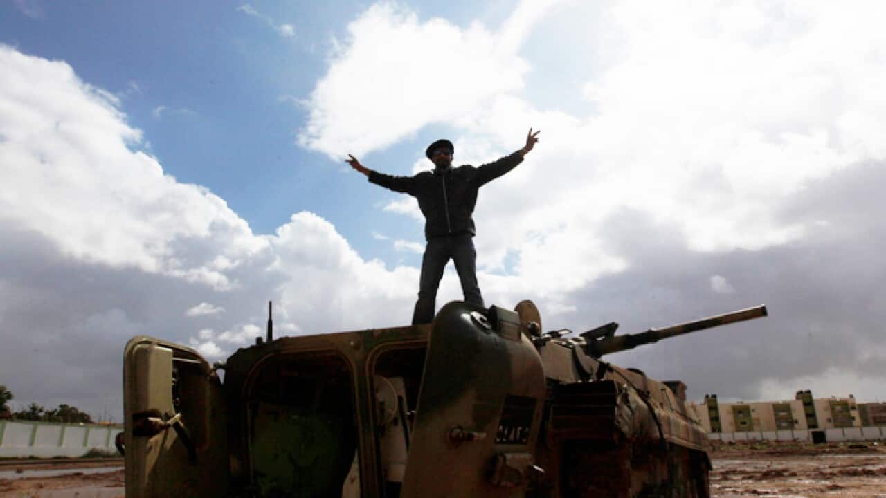 Libya-man-on-tank_B_AAP_1155426370
