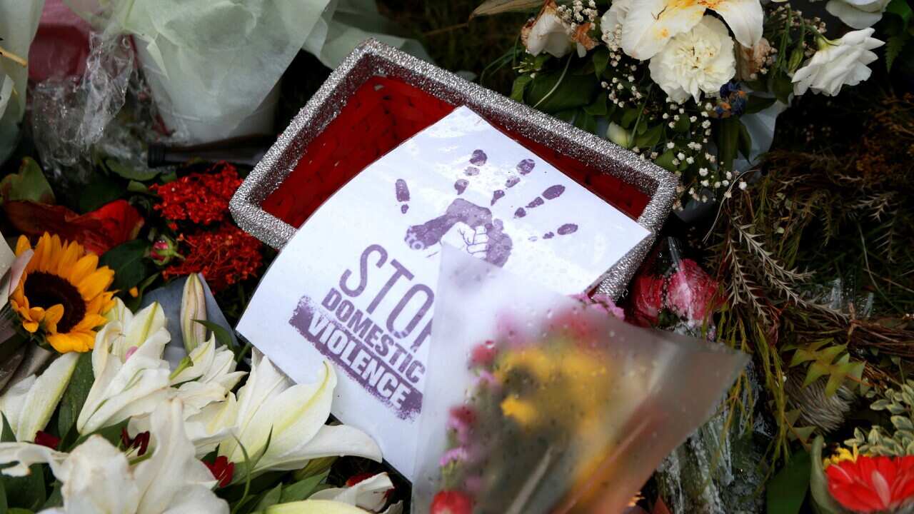 Flowers at a domestic violence vigil