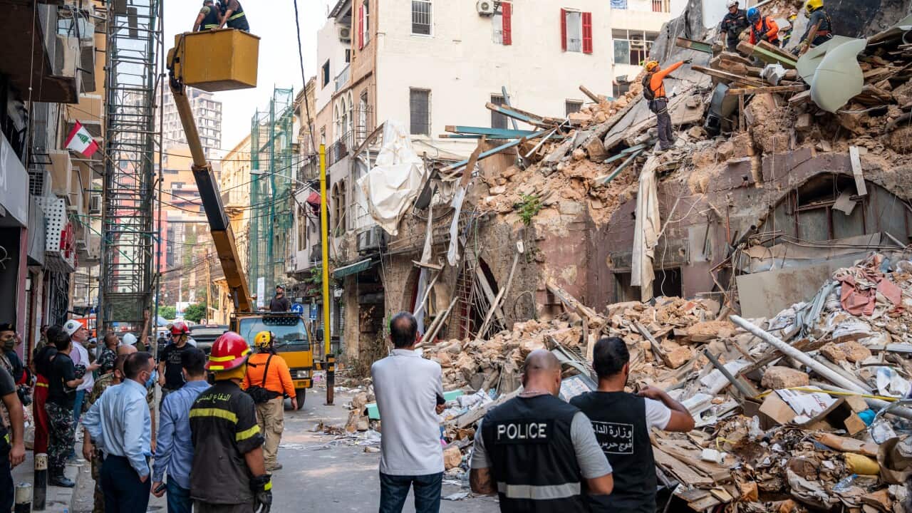 Workers search in the Gemmayzeh are in Beirut, Lebanon on September 3, 2020.