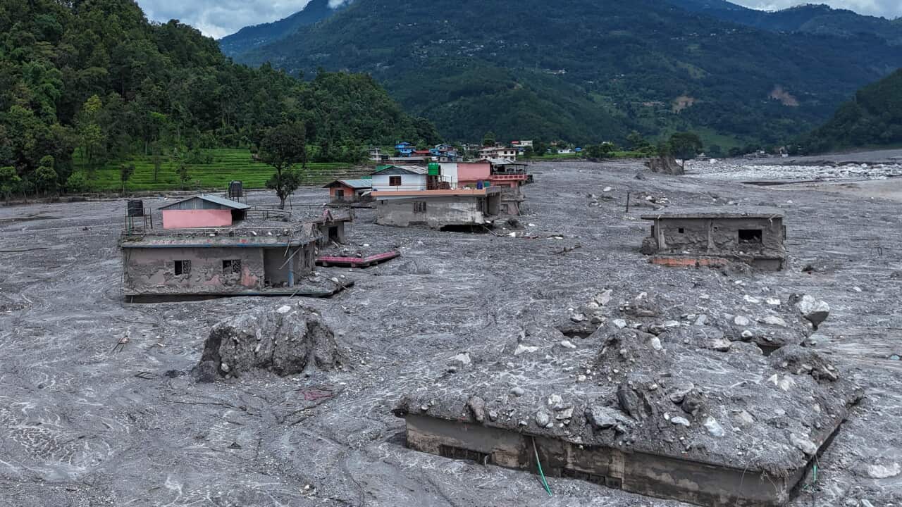 Buildings coated in mud and debris.